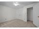 Neutral bedroom features plush carpeting, ceiling fan, double closets, and easy access to a walk-in closet at 8429 Bells Lake Rd, Apex, NC 27539