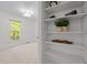 Bedroom view including decorative closet shelving and backyard view at 8429 Bells Lake Rd, Apex, NC 27539