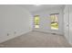 Bedroom featuring natural light and neutral carpet at 8429 Bells Lake Rd, Apex, NC 27539