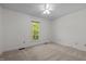 Bedroom with neutral carpet, ceiling fan, and natural lighting at 8429 Bells Lake Rd, Apex, NC 27539