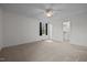 Light-filled bedroom features a walk-in closet and large window at 8429 Bells Lake Rd, Apex, NC 27539