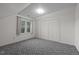 Bright bedroom featuring a window view and double door closet for ample storage at 8429 Bells Lake Rd, Apex, NC 27539