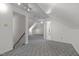 Upstairs bonus room featuring neutral walls, plush carpeting, and easy access to another room at 8429 Bells Lake Rd, Apex, NC 27539