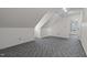 Upstairs bedroom featuring neutral walls, plush carpeting, and natural light at 8429 Bells Lake Rd, Apex, NC 27539