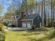 Exterior view of a home featuring a driveway, garage, and well-maintained lawn at 8429 Bells Lake Rd, Apex, NC 27539
