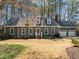 Charming home with a landscaped front yard, white trim, and a gray exterior at 8429 Bells Lake Rd, Apex, NC 27539