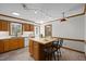 Traditional kitchen with a center island, wooden cabinetry, and tile flooring at 8429 Bells Lake Rd, Apex, NC 27539