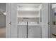Easy laundry access with this washer and dryer tucked into a hallway closet at 8429 Bells Lake Rd, Apex, NC 27539