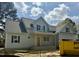 Charming gray home boasts a covered front porch and stylish black shutters at 902 Norwood Ln, Apex, NC 27502