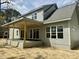 The rear of the house features a covered patio and large windows at 902 Norwood Ln, Apex, NC 27502