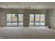 Unfinished room showcases double patio doors leading to outdoor space at 902 Norwood Ln, Apex, NC 27502