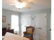 Bedroom with neutral paint, ceiling fan and woven chair at 903 Teague Pl, Durham, NC 27707