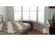 A bright bedroom with bay window and beautiful quilt at 903 Teague Pl, Durham, NC 27707