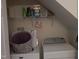 Functional laundry area featuring shelving, a washer, and a dryer at 903 Teague Pl, Durham, NC 27707