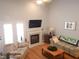 Bright living room with fireplace, large windows, and inviting decor at 903 Teague Pl, Durham, NC 27707