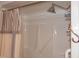 Enclosed shower with modern shower head and striped curtain at 903 Teague Pl, Durham, NC 27707