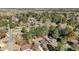 An aerial view showcases this home nestled amongst lush trees and nearby neighborhood streets at 914 S Crescent Dr, Smithfield, NC 27577