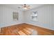 Bright bedroom features hardwood floors, ceiling fan and two windows for lots of natural light at 914 S Crescent Dr, Smithfield, NC 27577