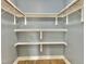 Walk-in closet with built-in shelving and ample storage space for organized living at 914 S Crescent Dr, Smithfield, NC 27577