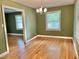 Dining area featuring hardwood floors, a chandelier and ample natural light from two windows at 914 S Crescent Dr, Smithfield, NC 27577