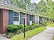 Classic brick facade accented with blue shutters and manicured landscaping enhancing the curb appeal at 914 S Crescent Dr, Smithfield, NC 27577