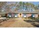 Charming brick home with blue shutters and a wooden door is complemented by mature landscaping at 914 S Crescent Dr, Smithfield, NC 27577