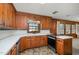 Classic kitchen with wooden cabinets, stainless steel appliances, and white tile countertops at 914 S Crescent Dr, Smithfield, NC 27577