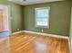 Sunlit room with hardwood floors and a view of the entry and a window with natural light at 914 S Crescent Dr, Smithfield, NC 27577