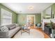 Cozy living room with fireplace, stylish furnishings, and a view into the dining area at 914 S Crescent Dr, Smithfield, NC 27577