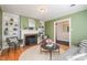 Inviting living room features a fireplace, built-in shelving, and hardwood floors at 914 S Crescent Dr, Smithfield, NC 27577