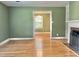 Open living space with hardwood floors leading to the dining room at 914 S Crescent Dr, Smithfield, NC 27577