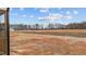 View from the screened porch to the expansive backyard at 9353 Turkey Way, Middlesex, NC 27557