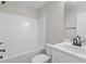 Cozy bathroom featuring a toilet, tub with shower, and vanity with sink and black faucet at 9353 Turkey Way, Middlesex, NC 27557