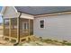 View of the home's screened porch and gray siding at 9353 Turkey Way, Middlesex, NC 27557