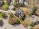 Aerial view of a home and property featuring mature trees and manicured lawn at 101 Listokin Ct, Cary, NC 27519