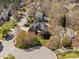 Lovely aerial view of a two story home with lush landscaping and mature trees in a well kept neighborhood at 101 Listokin Ct, Cary, NC 27519