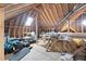 Spacious unfinished attic with exposed rafters, skylight, and plenty of storage space at 101 Listokin Ct, Cary, NC 27519