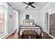 Stylish bedroom with natural light, a metal bed frame, and decorative accents at 101 Listokin Ct, Cary, NC 27519