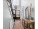 Inviting foyer boasts hardwood floors, a striking staircase, and a decorative wooden table at 101 Listokin Ct, Cary, NC 27519