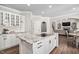 Open concept kitchen with granite island, stainless appliances, and hardwood floors at 101 Listokin Ct, Cary, NC 27519