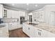 Modern kitchen with granite countertops, stainless steel appliances, and ample cabinet space at 101 Listokin Ct, Cary, NC 27519