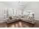 Open living room with vaulted ceilings, large windows, and an open layout to the kitchen at 101 Listokin Ct, Cary, NC 27519
