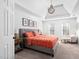 Bright main bedroom features a trey ceiling, windows, and a full-size bed at 101 Listokin Ct, Cary, NC 27519