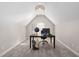 Home office featuring a large desk, globe, and vaulted ceilings at 101 Listokin Ct, Cary, NC 27519
