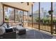 Relaxing screened porch with comfortable seating, ceiling fan, and views of the landscaped backyard at 101 Listokin Ct, Cary, NC 27519