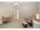 Neutral bedroom with a rocking chair, a dressing table and carpeted floor, ideal for a growing Gathering at 102 Battenburg Ct, Cary, NC 27519