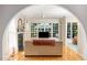 Bright living area with hardwood floors, a fireplace, and open access to the dining space at 102 Battenburg Ct, Cary, NC 27519