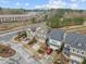 Aerial view of homes featuring neat landscaping, driveways and well maintained lawns at 105 Concordia Woods Dr, Morrisville, NC 27560
