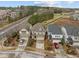 Aerial view of homes featuring neat landscaping, driveways and well maintained lawns at 105 Concordia Woods Dr, Morrisville, NC 27560