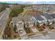 Aerial view of homes featuring neat landscaping, driveways and well maintained lawns at 105 Concordia Woods Dr, Morrisville, NC 27560